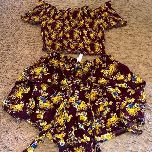 Medium 2 piece short/skort set with stretchy top.